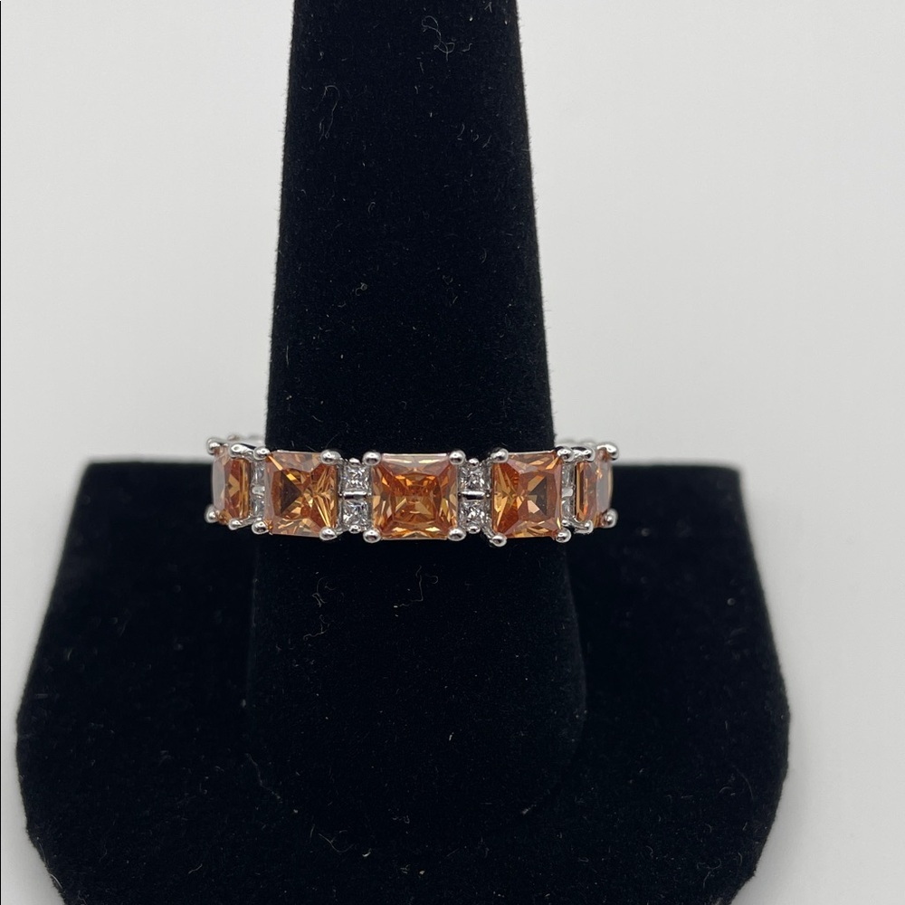 Bomb Party ring with Amber Color stones. Size 11. Rhodium plated.  Beautiful.